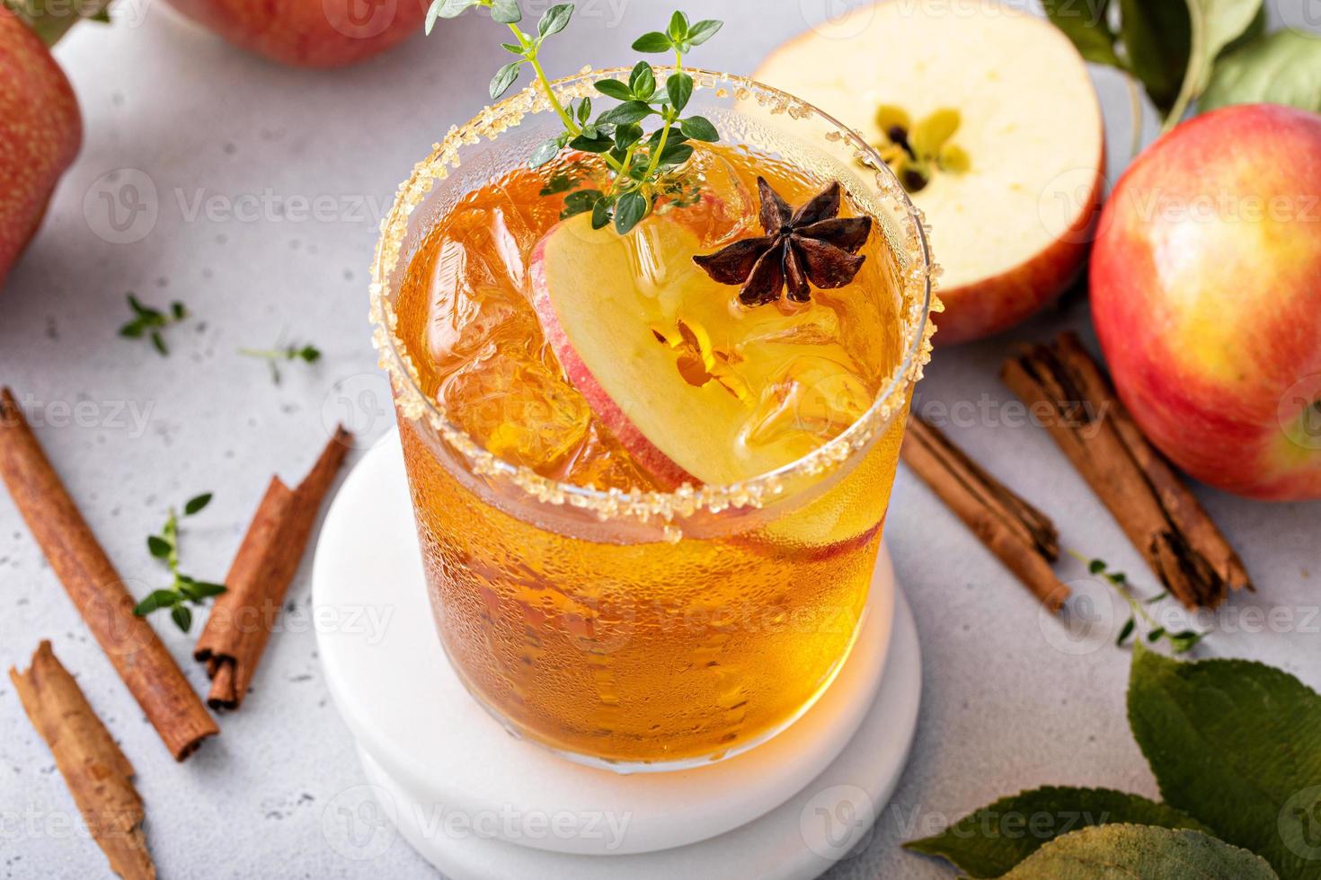 Apple cider margarita with brown sugar rim and fresh thyme photo