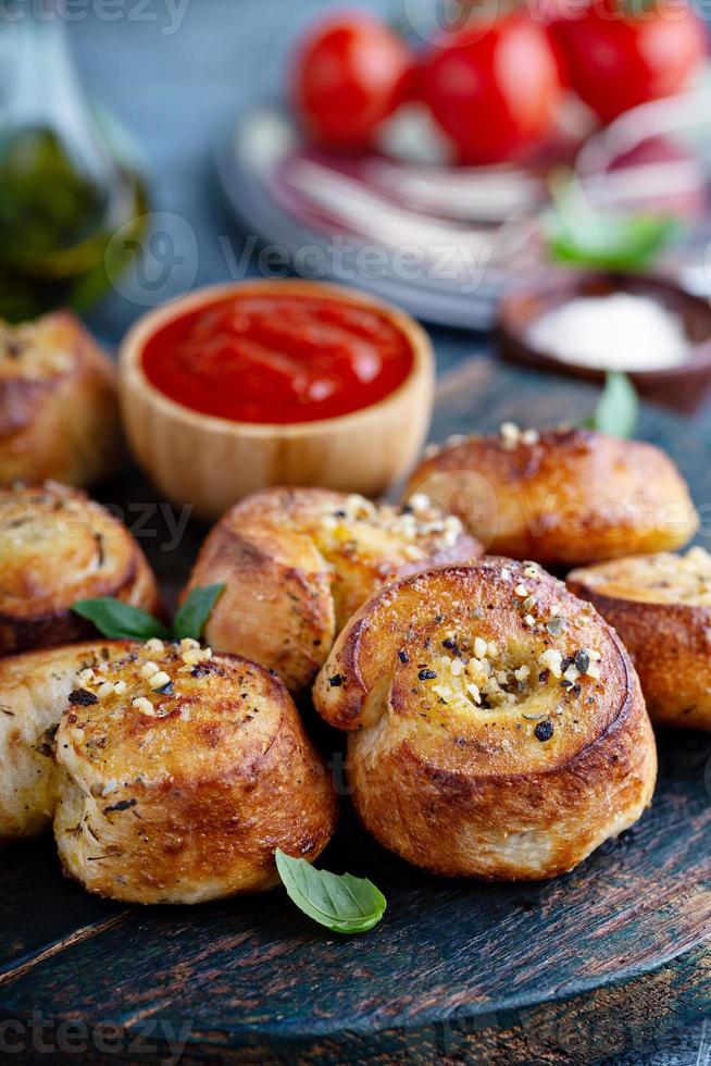 Garlic dinner rolls with marinara sauce photo