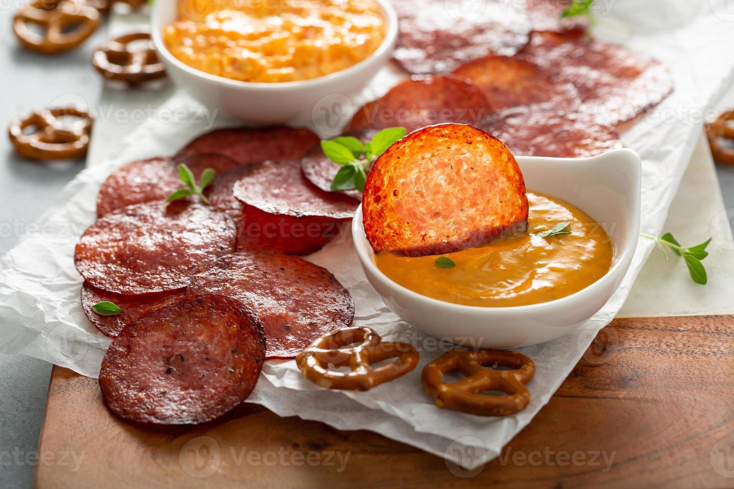 Salami chips baked in the oven with cheese sauces 16212104 Stock Photo