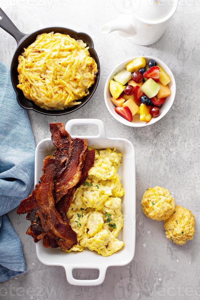 Full breakfast with scrambled eggs, bacon and potatoes photo