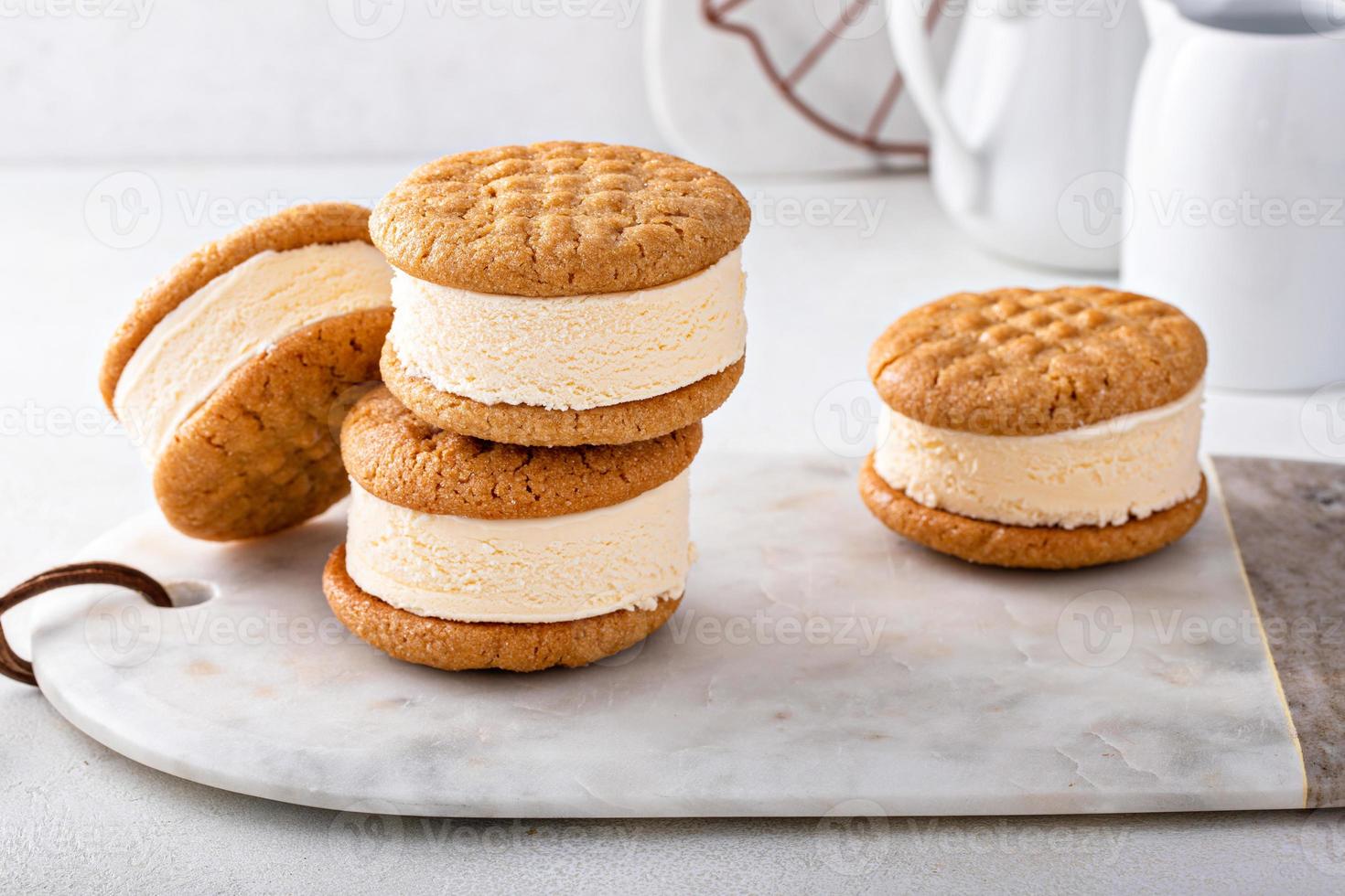 Ice cream and cookies sandwiches stacked on the table photo