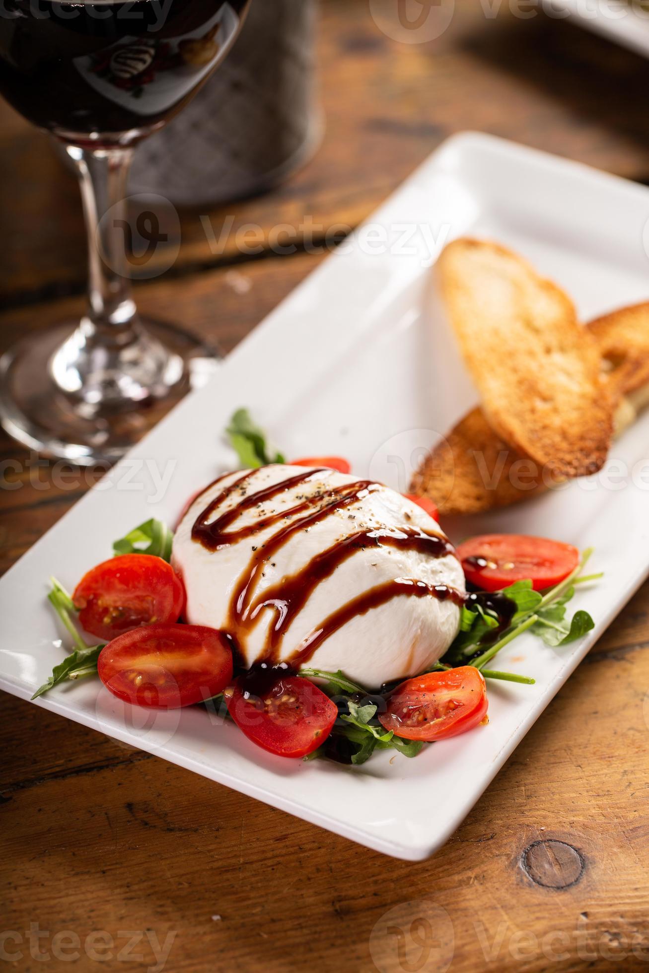 Italian appetizer plate with burrata and prosciutto 16212313 Stock