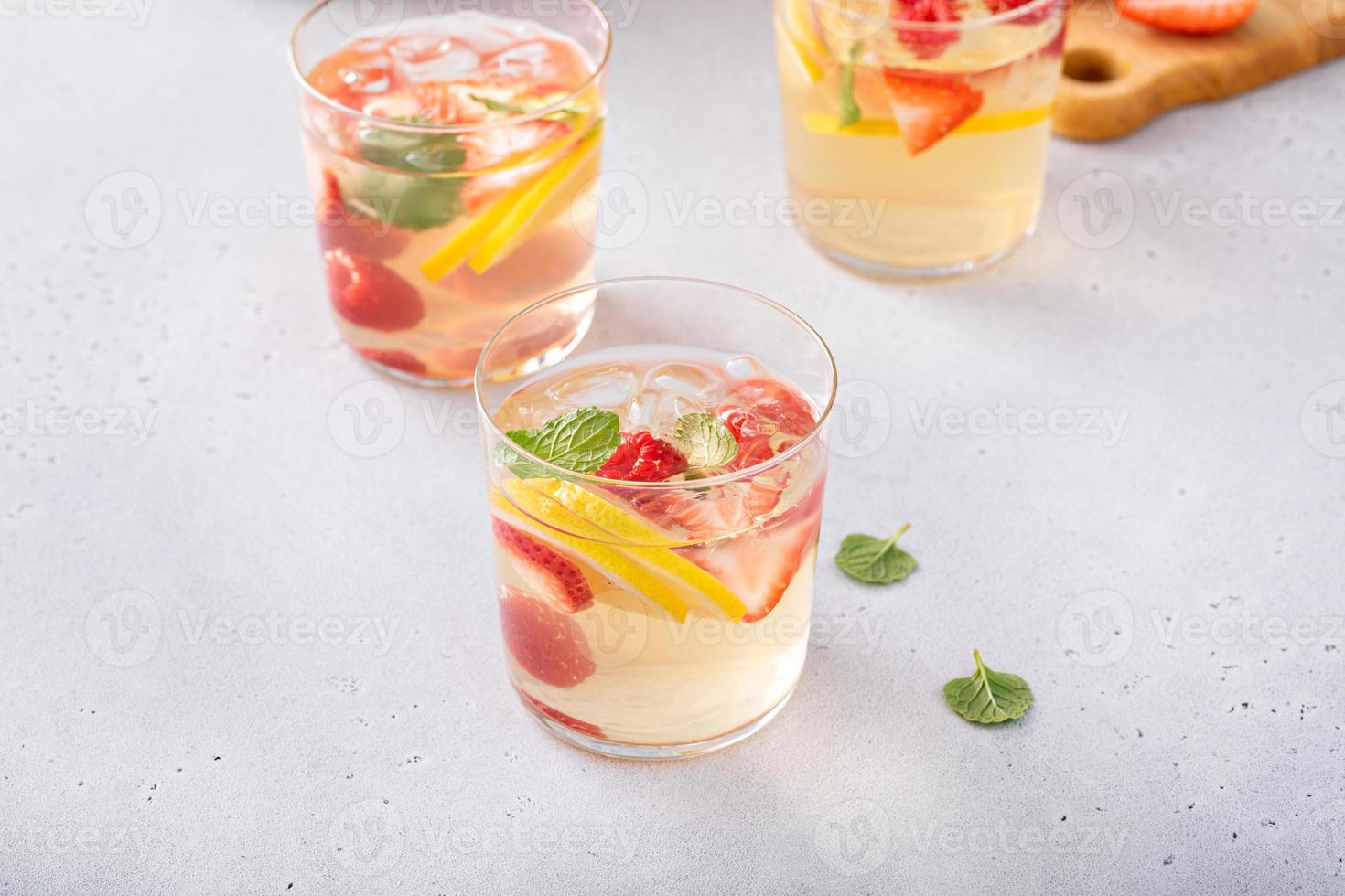 Summer sangria punch in a pitcher and glasses photo