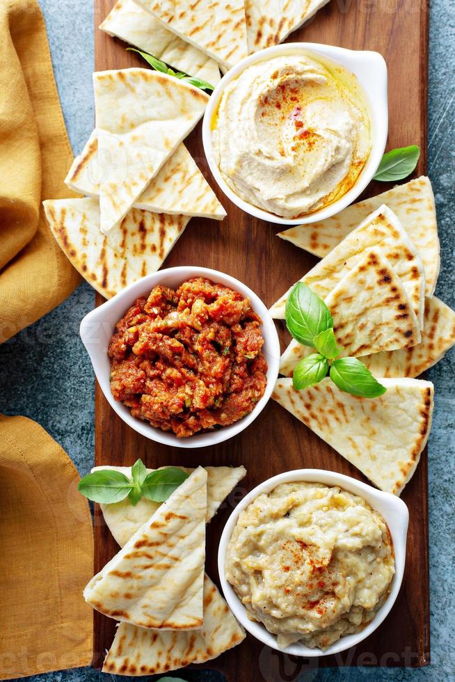 Mezze board with pita and dips photo