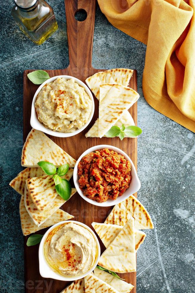 Mezze board with pita and dips photo