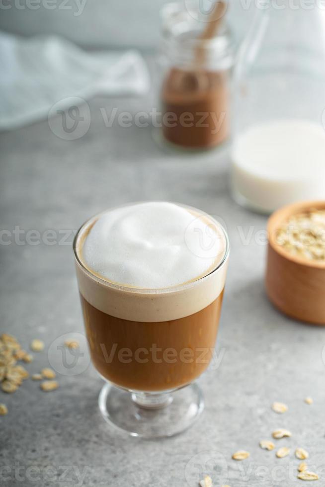 Oat milk latte with thick foam photo