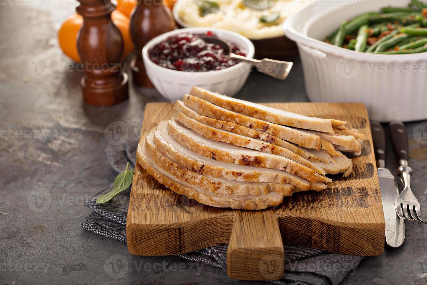 Sliced turkey on Thanksgiving or Christmas table photo