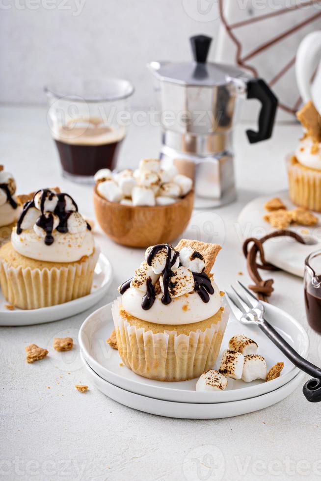 Smores cupcakes with graham crackers, toasted marshmallows and chocolate photo