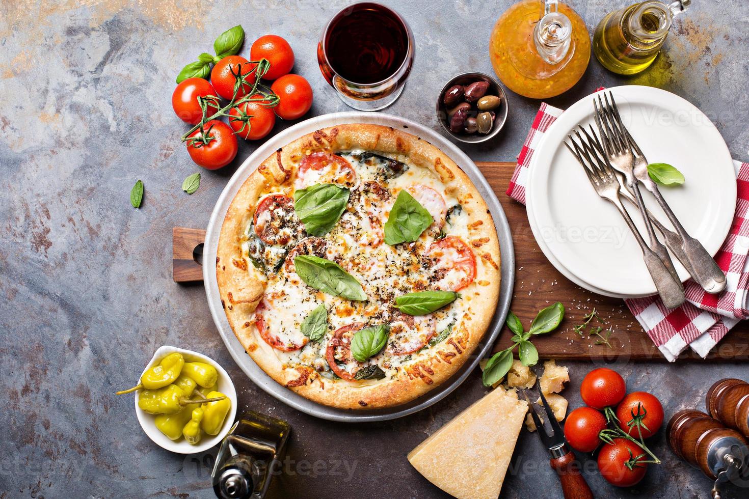 Pizza Margarita with garnishes photo