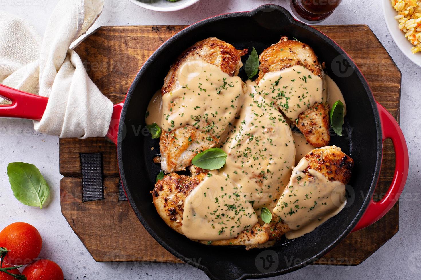 Cooked chicken breast in a skillet photo