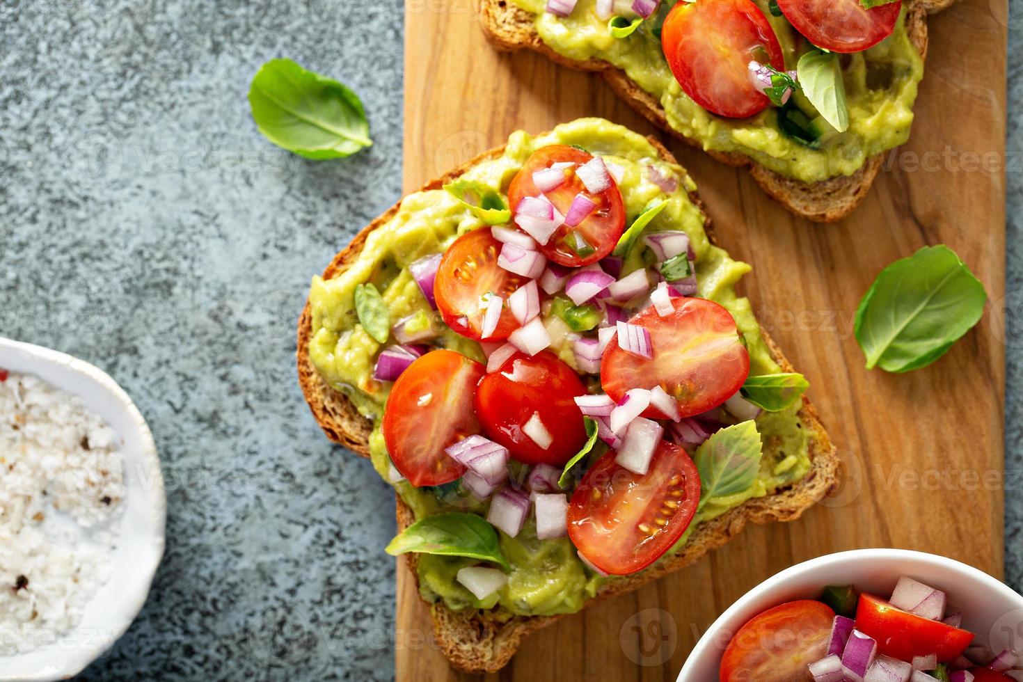 Fresh guacamole and tomato sandwich spread photo