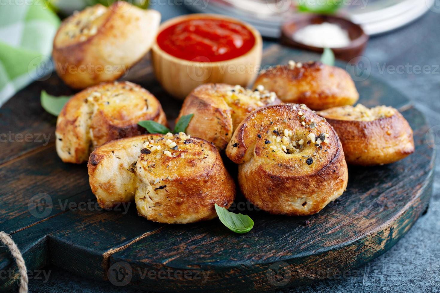 Garlic dinner rolls with marinara sauce photo