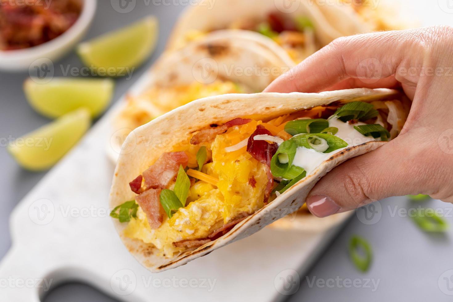 Breakfast tacos with hashbrowns, eggs and bacon photo