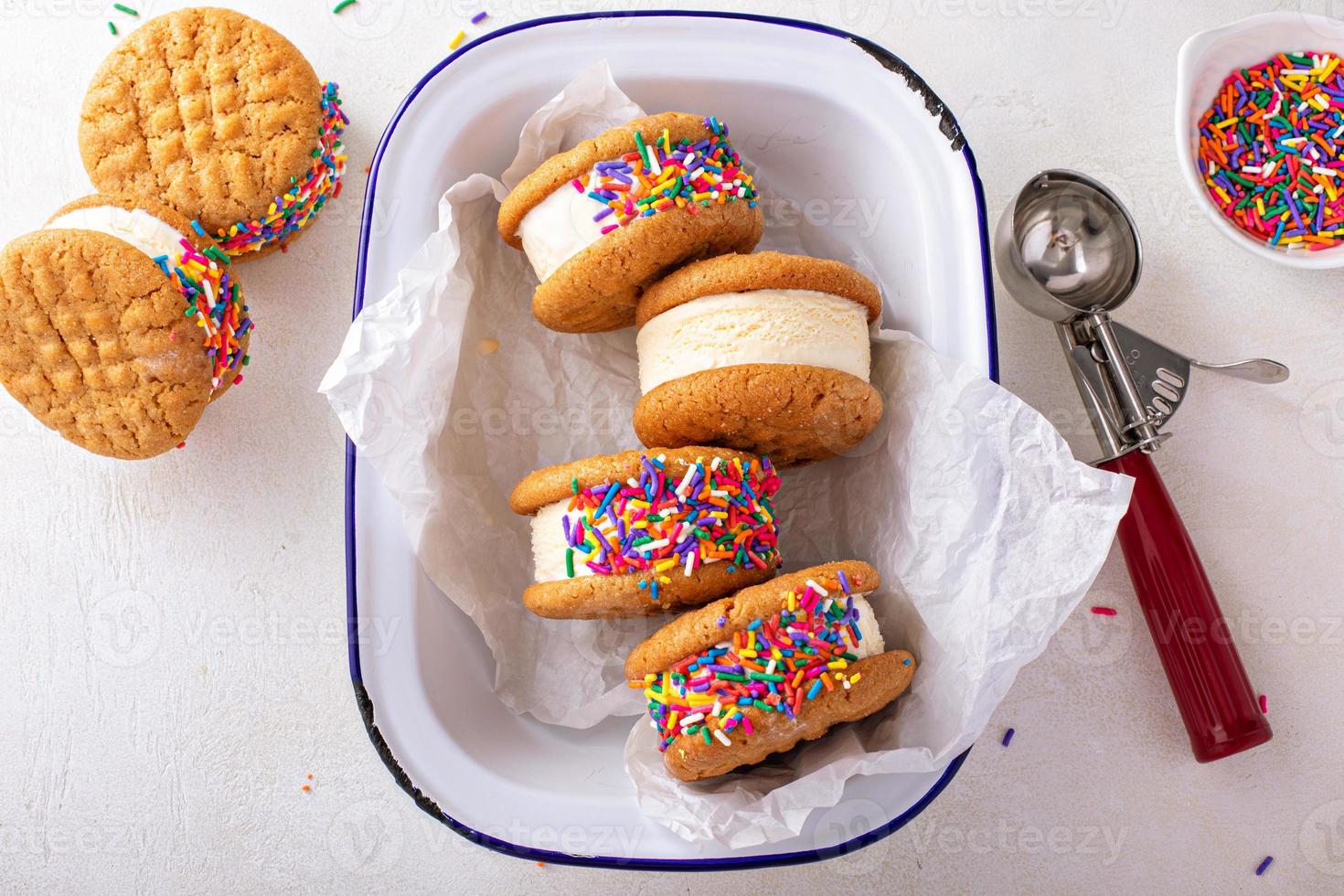 Ice cream and cookies sandwiches stacked on the table photo