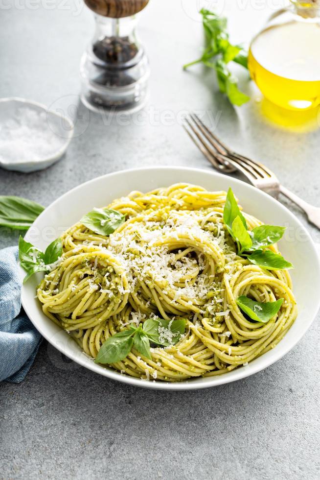 Basil pesto pasta with parmesan and olive oil photo