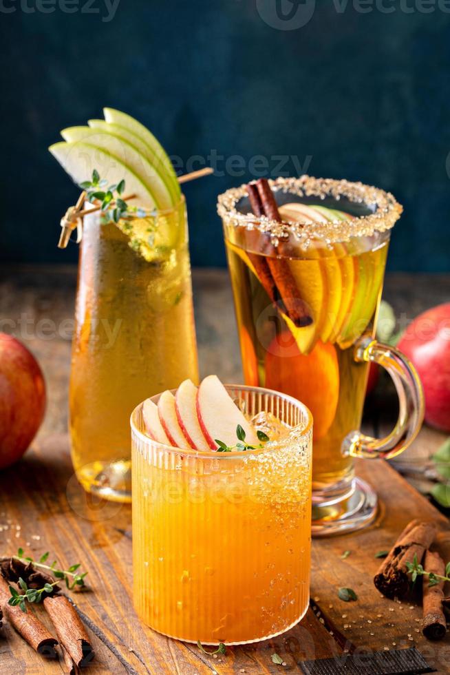 Variety of fall cocktails or mocktails made with apple cider photo