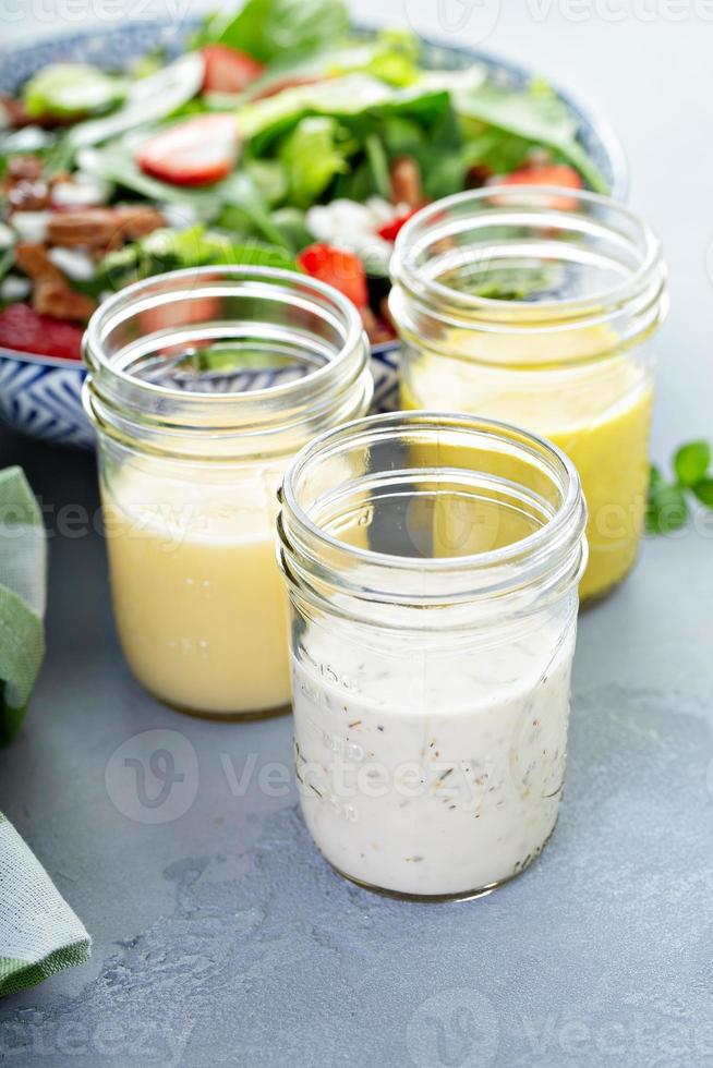 Variety of salad dressings in glass jars 16218091 Stock Photo at Vecteezy