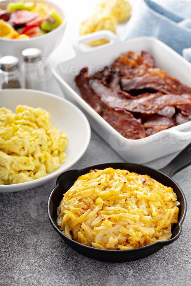 Full breakfast with scrambled eggs, bacon and potatoes photo