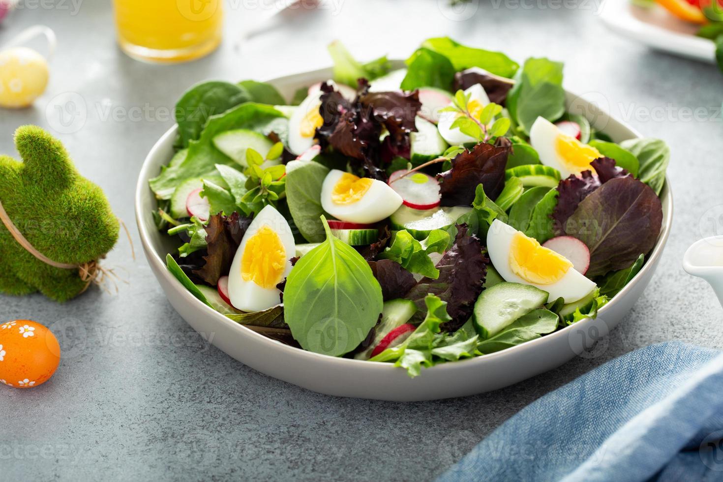 Fresh green salad with boiled eggs for Easter brunch photo
