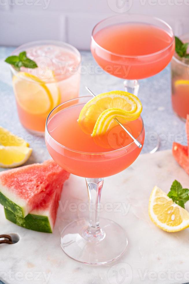 Watermelon and citrus cocktail with lemon garnish photo