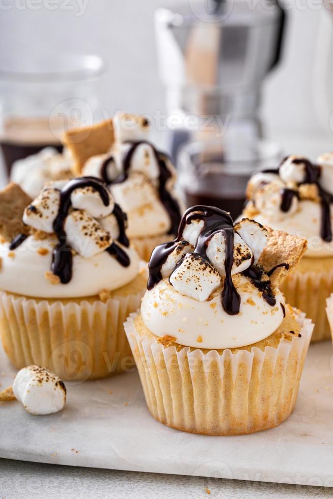 Smores cupcakes with graham crackers, toasted marshmallows and chocolate photo