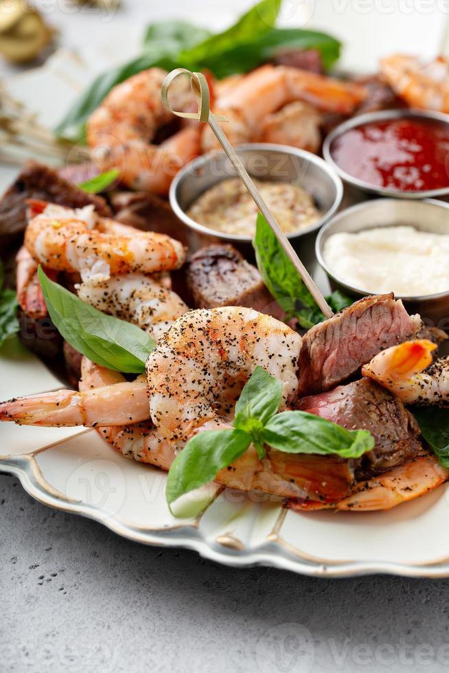 Christmas or New Year party appetizer, shrimp and steak photo