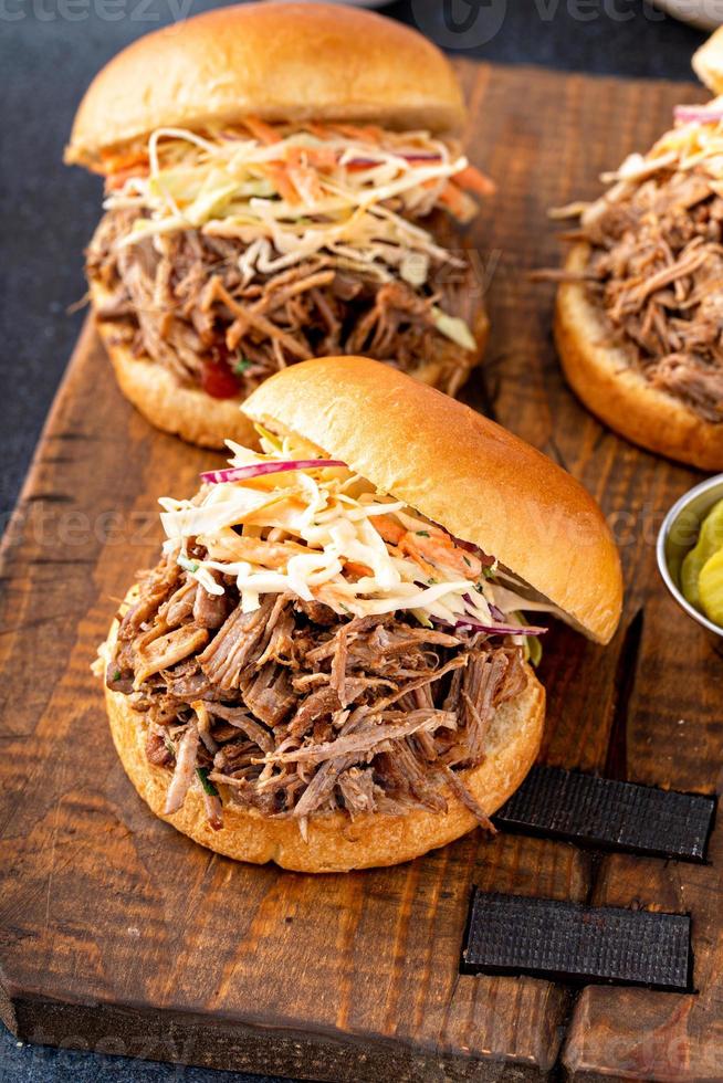 Pulled pork sandwiches with cole slaw on brioche buns photo