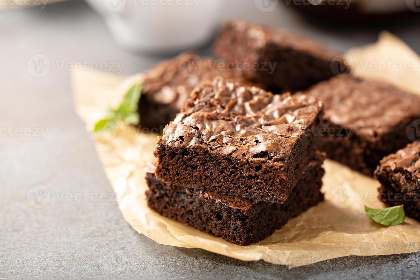 Freshly baked brownies on a parchment paper 16222498 Stock Photo at