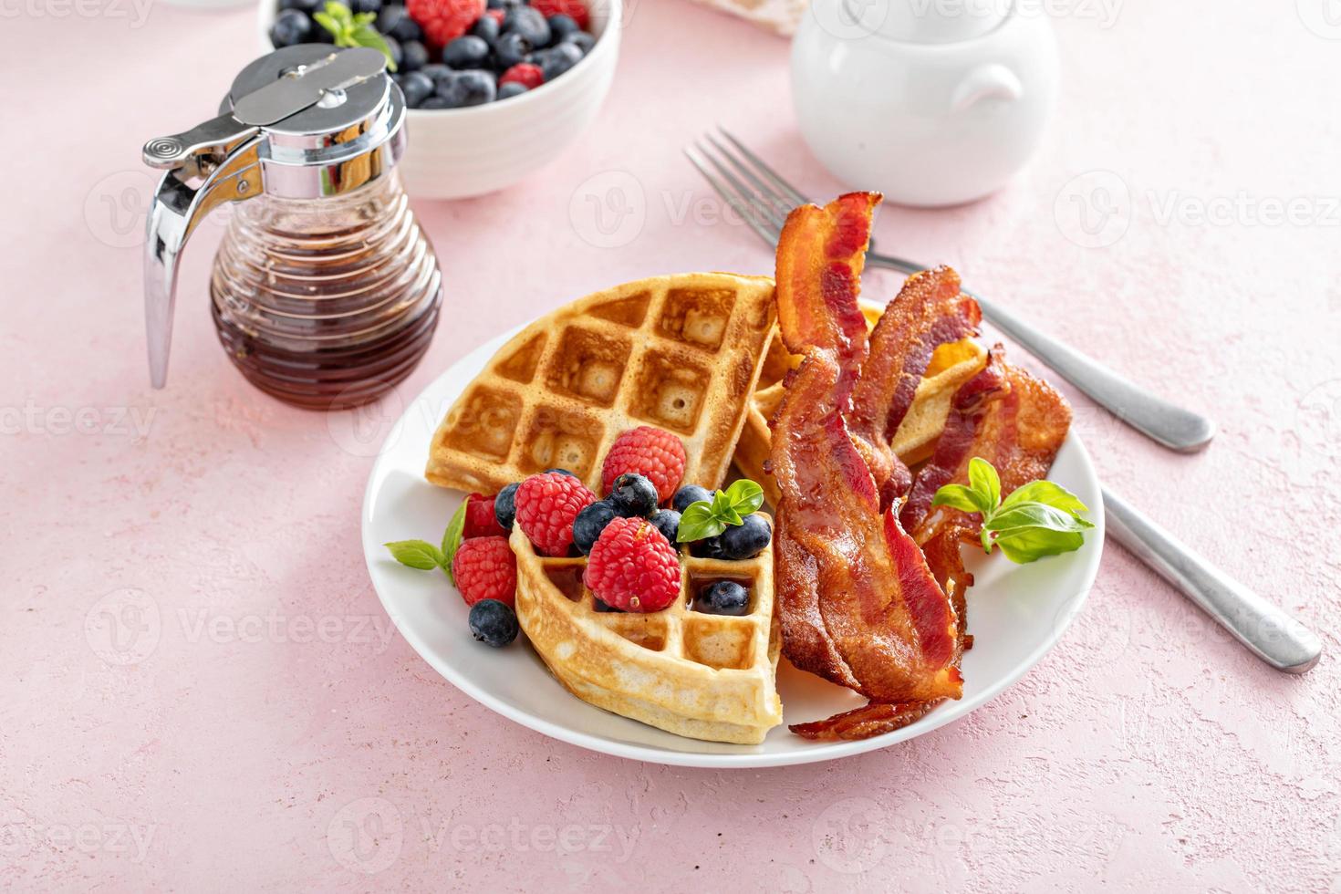 Belgian waffles with bacon and fresh berries for breakfast photo
