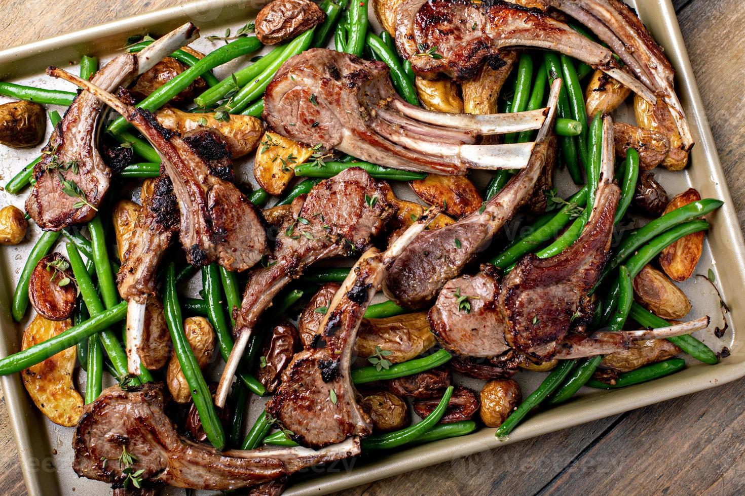 Grilled or roasted lamb chops with green beans and potatoes photo