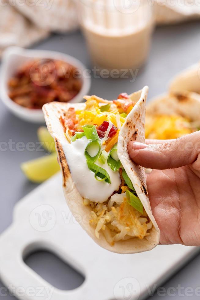 Breakfast tacos with hashbrowns, eggs and bacon photo