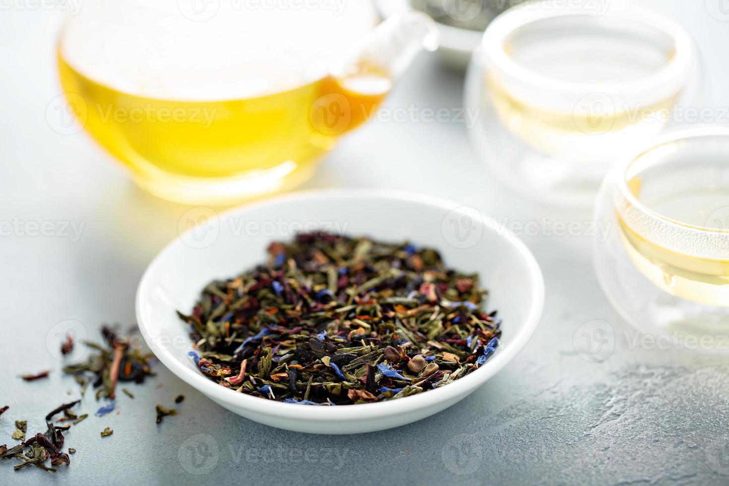 Green loose leaf tea and a teapot 16222545 Stock Photo at Vecteezy