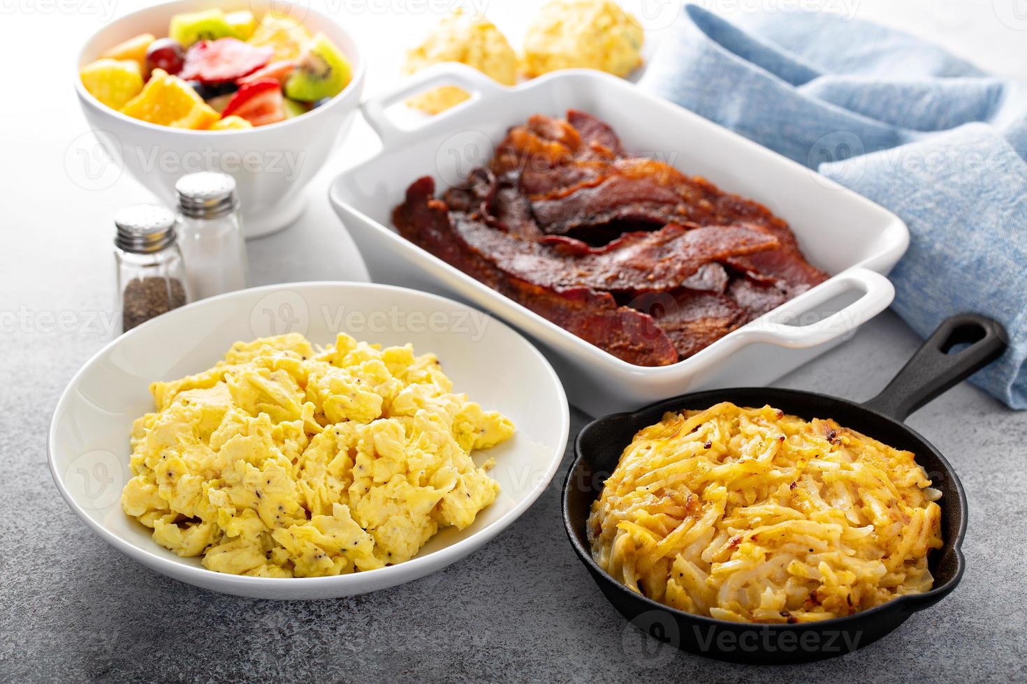 Full breakfast with scrambled eggs, bacon and potatoes photo