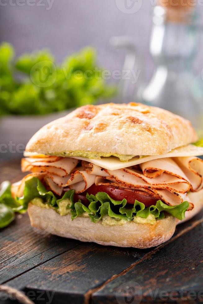 Fresh and healthy pesto turkey sandwich photo