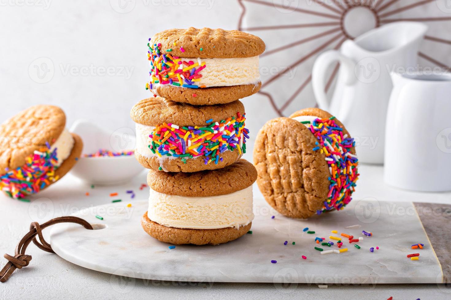 Ice cream and cookies sandwiches stacked on the table photo