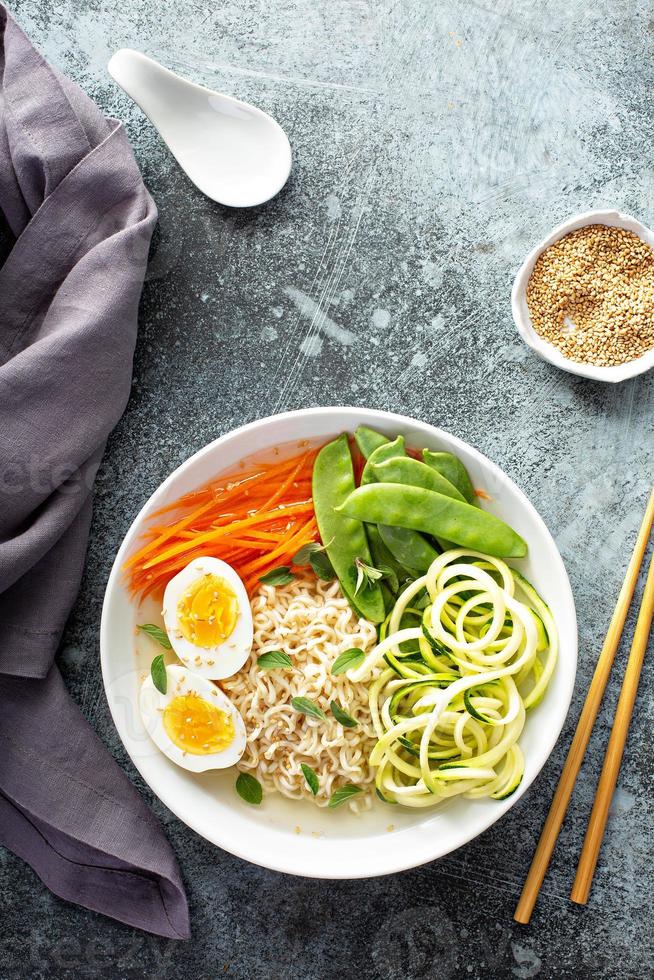 Bowl of noodles with egg and vegetables photo