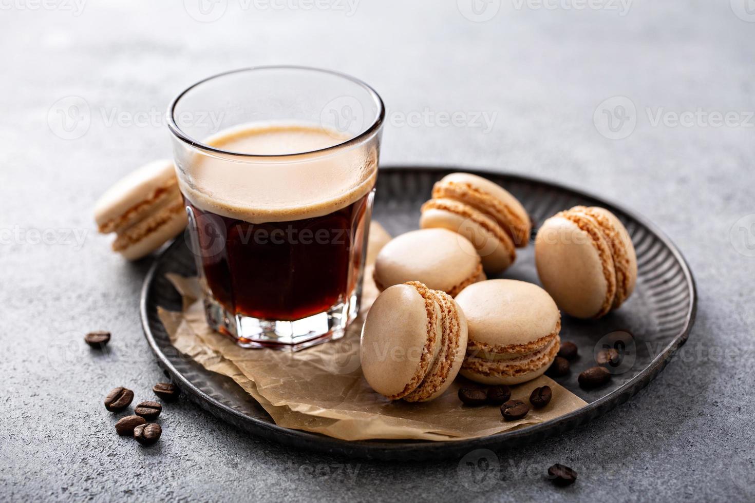 Coffee or chocolate macarons on a tray photo