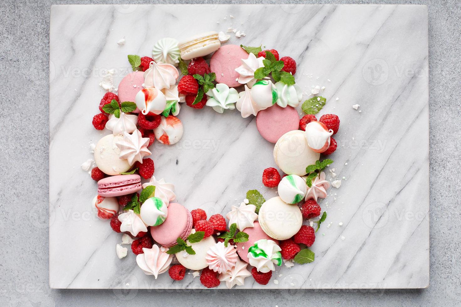 Christmas dessert wreath with macarons and meringues photo