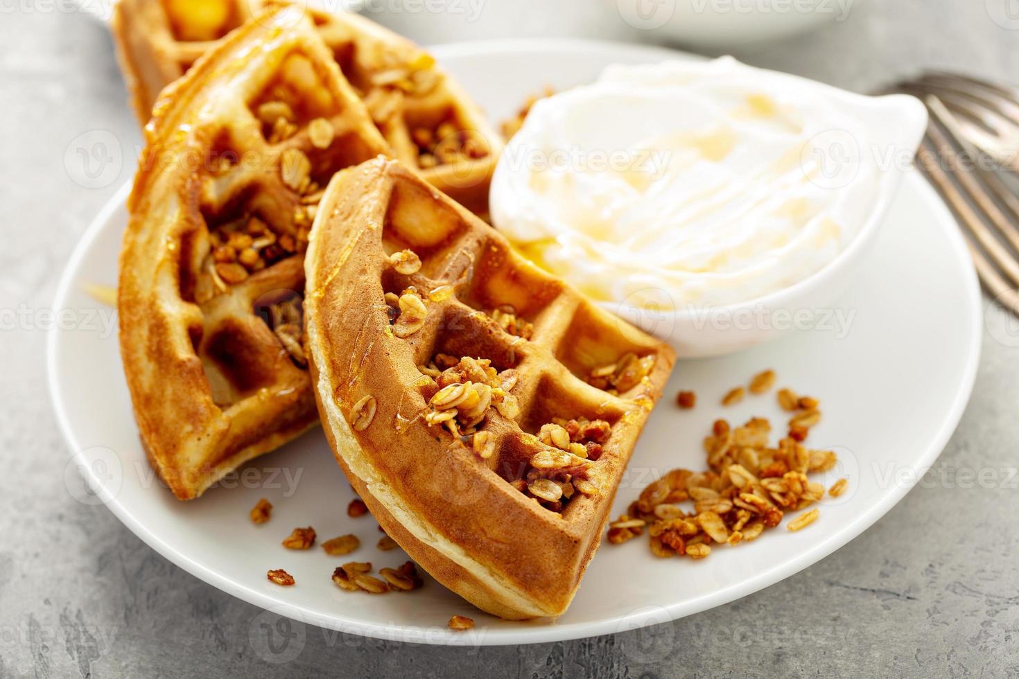 Breakfast waffles with yogurt and granola photo