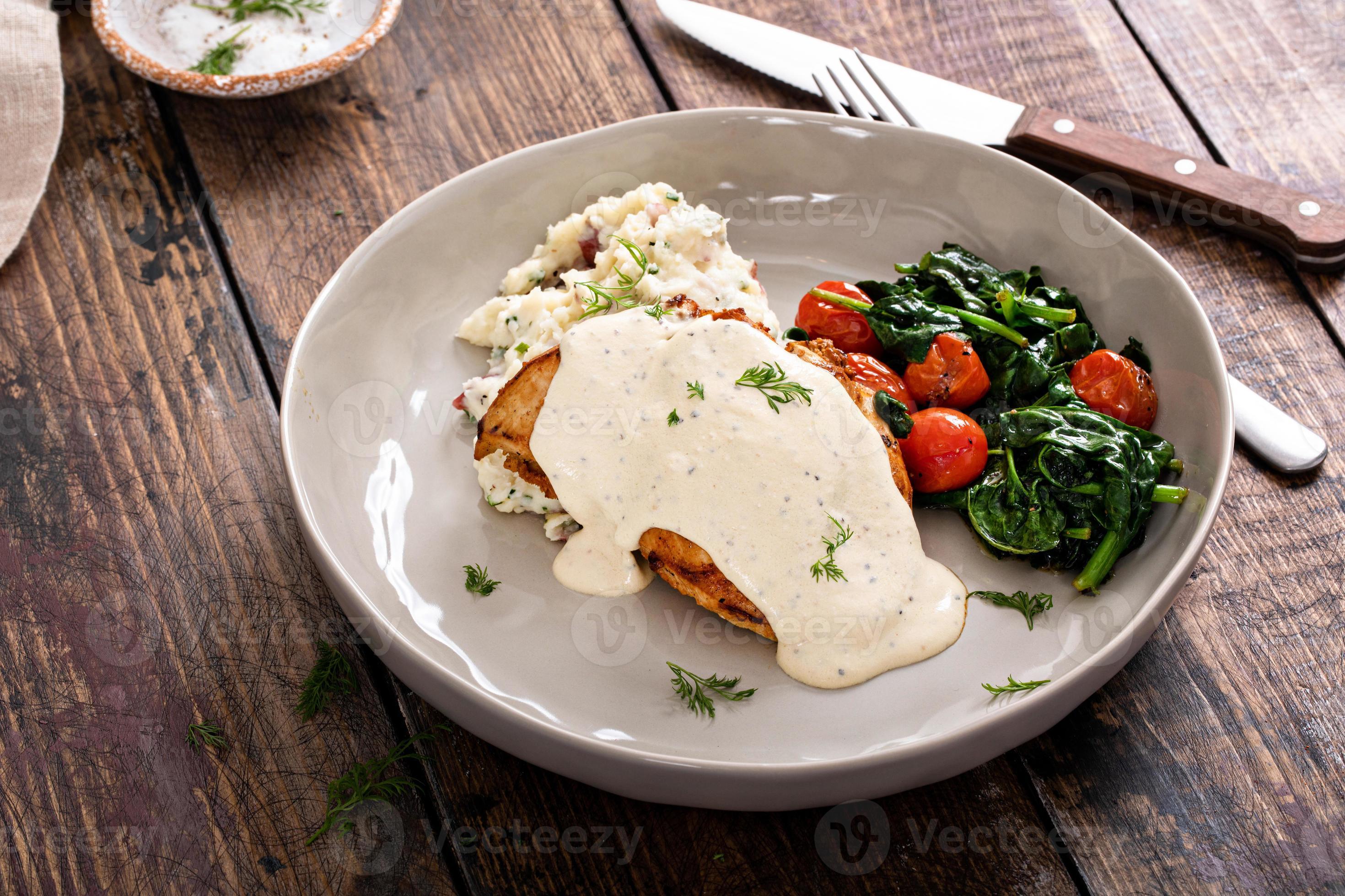 Roasted chicken thighs with dill pickle sauce 16230448 Stock Photo at