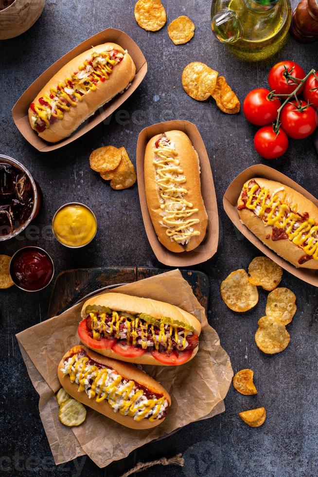 Variety of hot dogs with ketchup and mustard photo