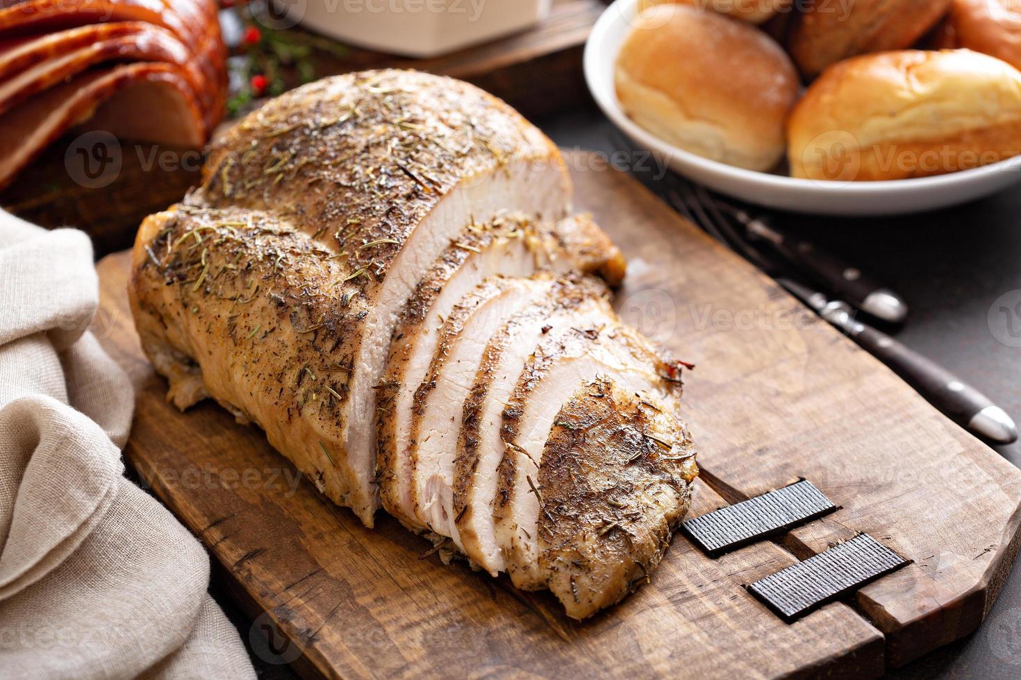 Sliced turkey on Thanksgiving or Christmas table photo