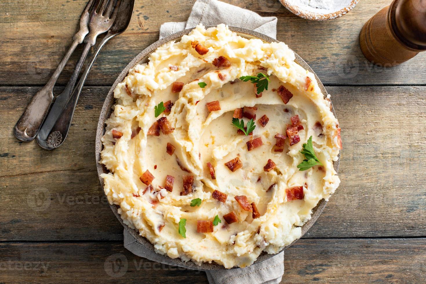 Bacon mashed potatoes with cheddar cheese and parsley photo