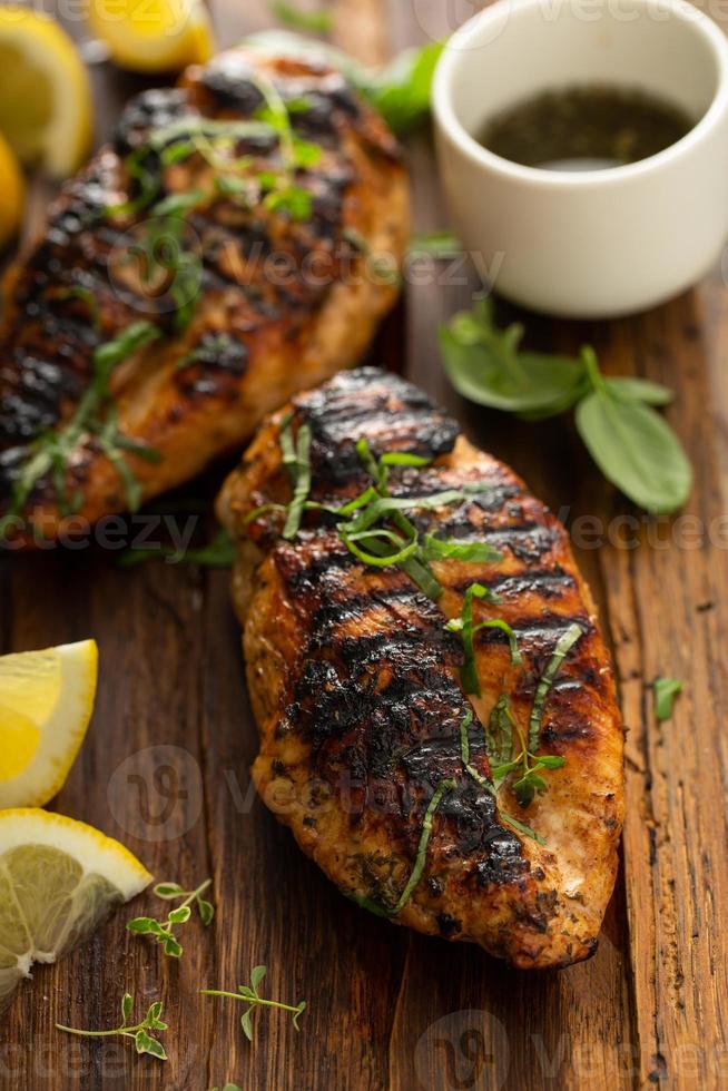 Balsamic grilled chicken breast on a board photo