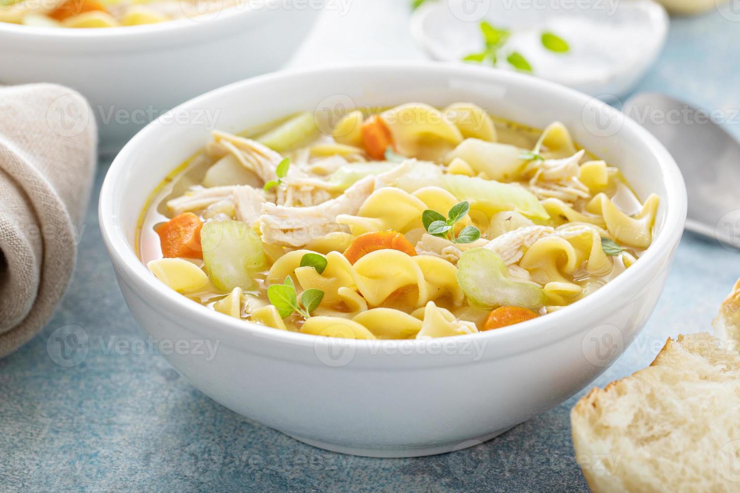 Traditional chicken noodle soup with egg noodles photo
