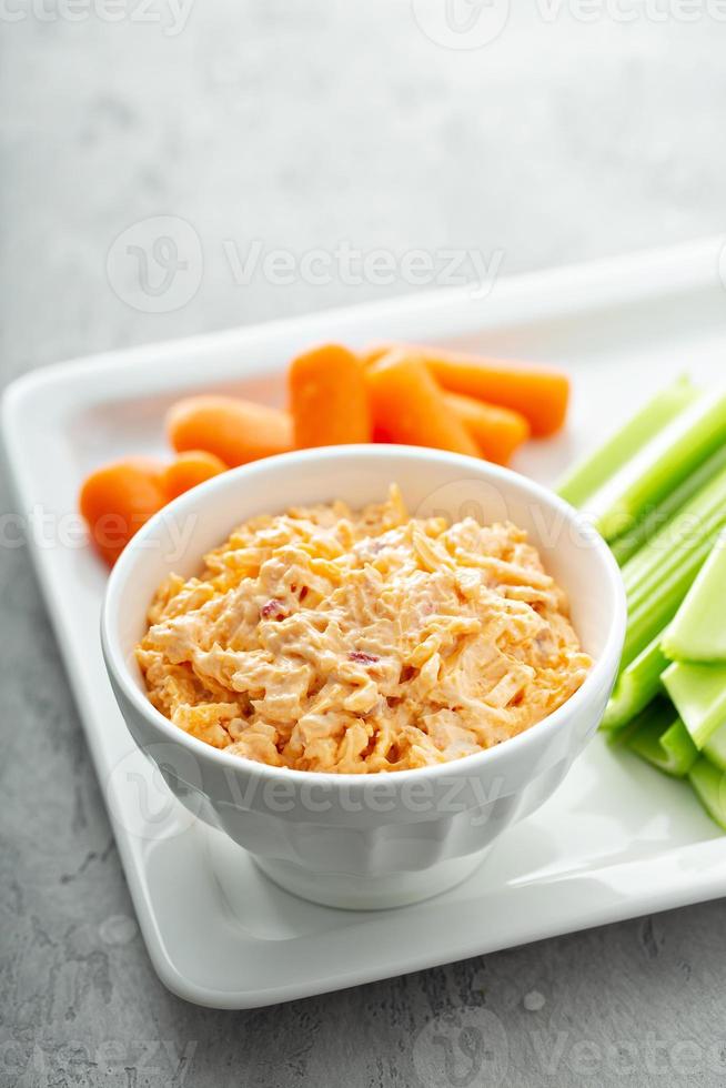 Pimento cheese with celery and carrot photo