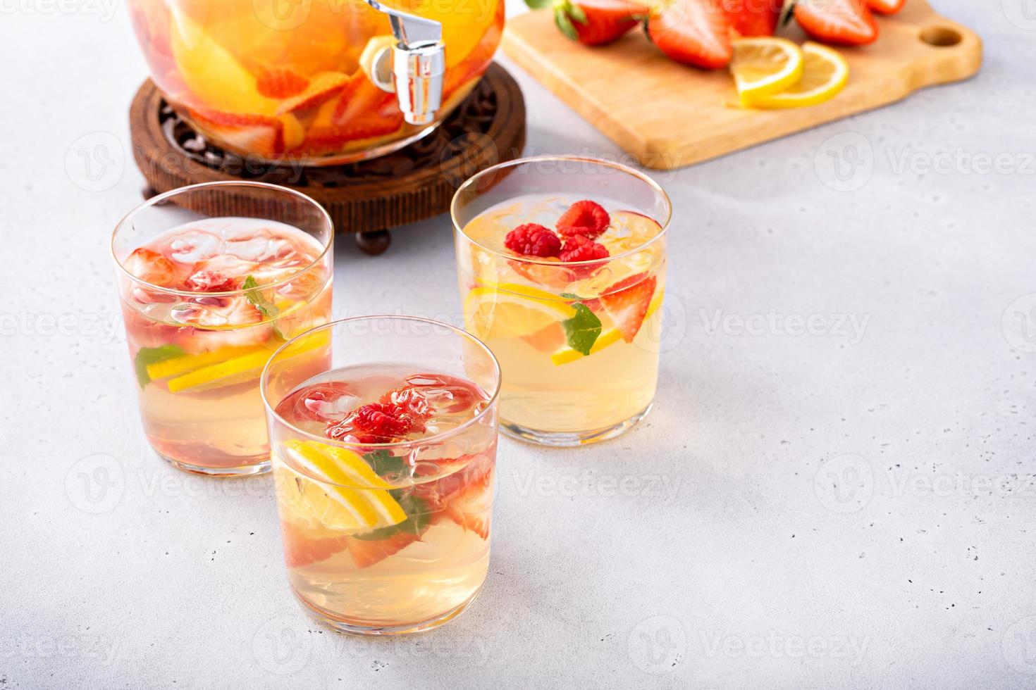 Summer sangria punch in a pitcher and glasses photo