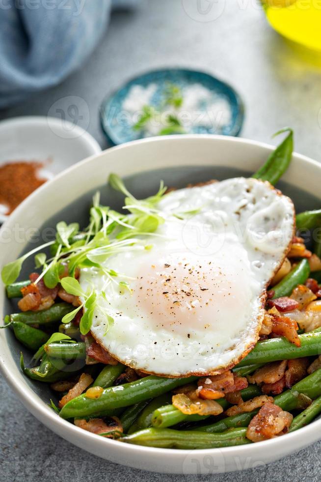 Healthy and filling breakfast with egg, green beans and bacon photo
