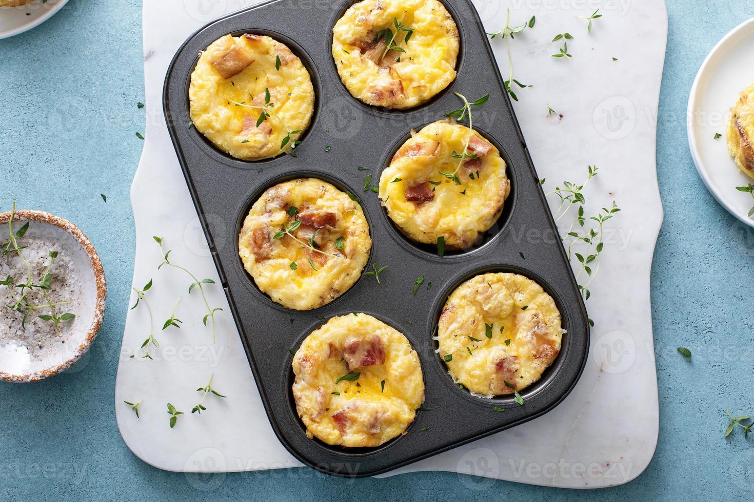 Bacon and cheddar egg muffins for breakfast photo