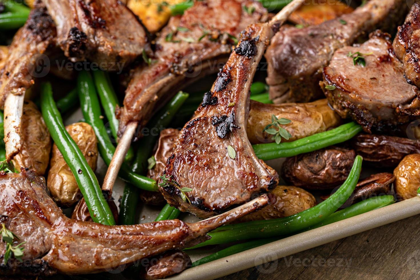 Grilled or roasted lamb chops with green beans and potatoes photo